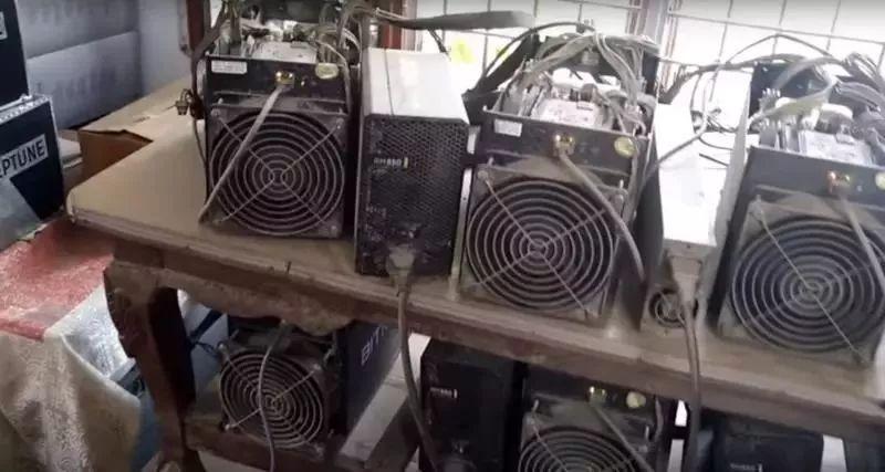 Close-up of a mining rig displaying intricate details and its operational status